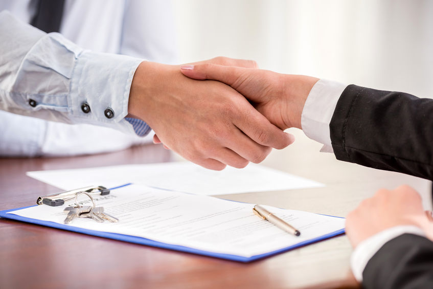 handshake of a real estate agent and a client.