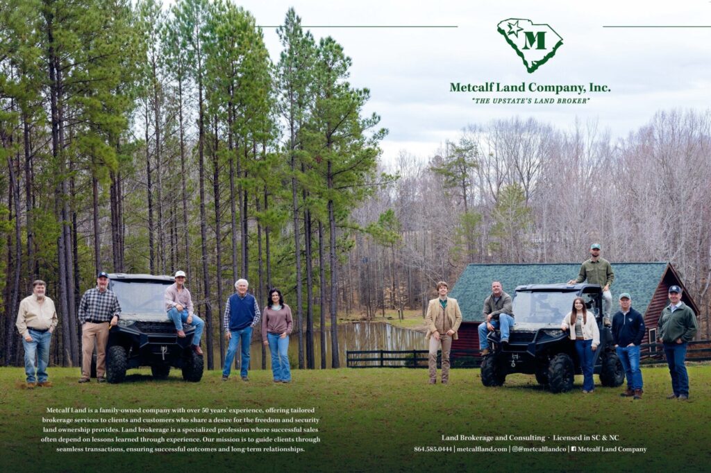 Image of workers of Metcalf Land Company posing on land for The Guide