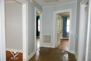 Hallway view of a 2 bed, 1 bath home in Inman, featuring light blue walls and doorways leading to adjacent rooms. Hallway view of a 2 bed, 1 bath home in Inman, featuring light blue walls and doorways leading to adjacent rooms.