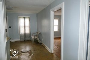 Interior view of a 2-bedroom, 1-bath home in Inman, featuring a chair, window with curtains, and visible flooring. Interior view of a 2-bedroom, 1-bath home in Inman, featuring a chair, window with curtains, and visible flooring.