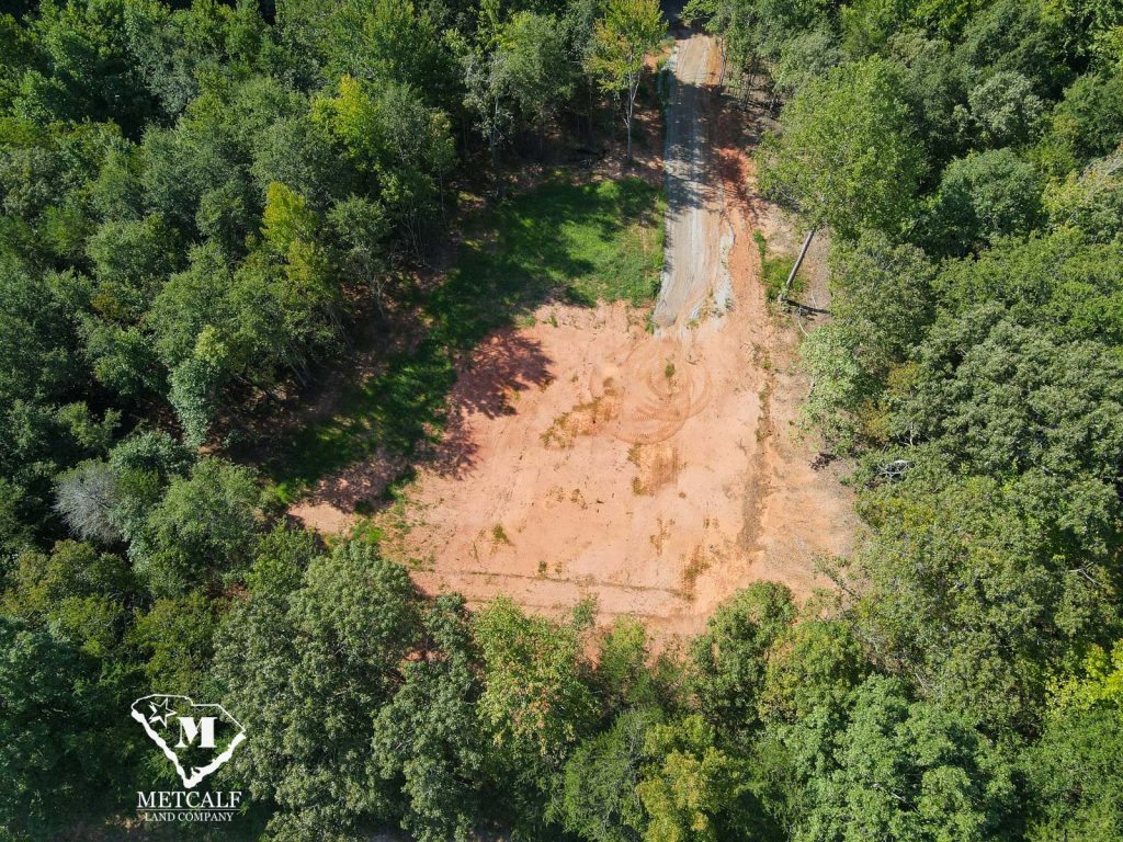 Aerial view of a cleared 2.5-acre homesite surrounded by trees in Campobello, South Carolina.