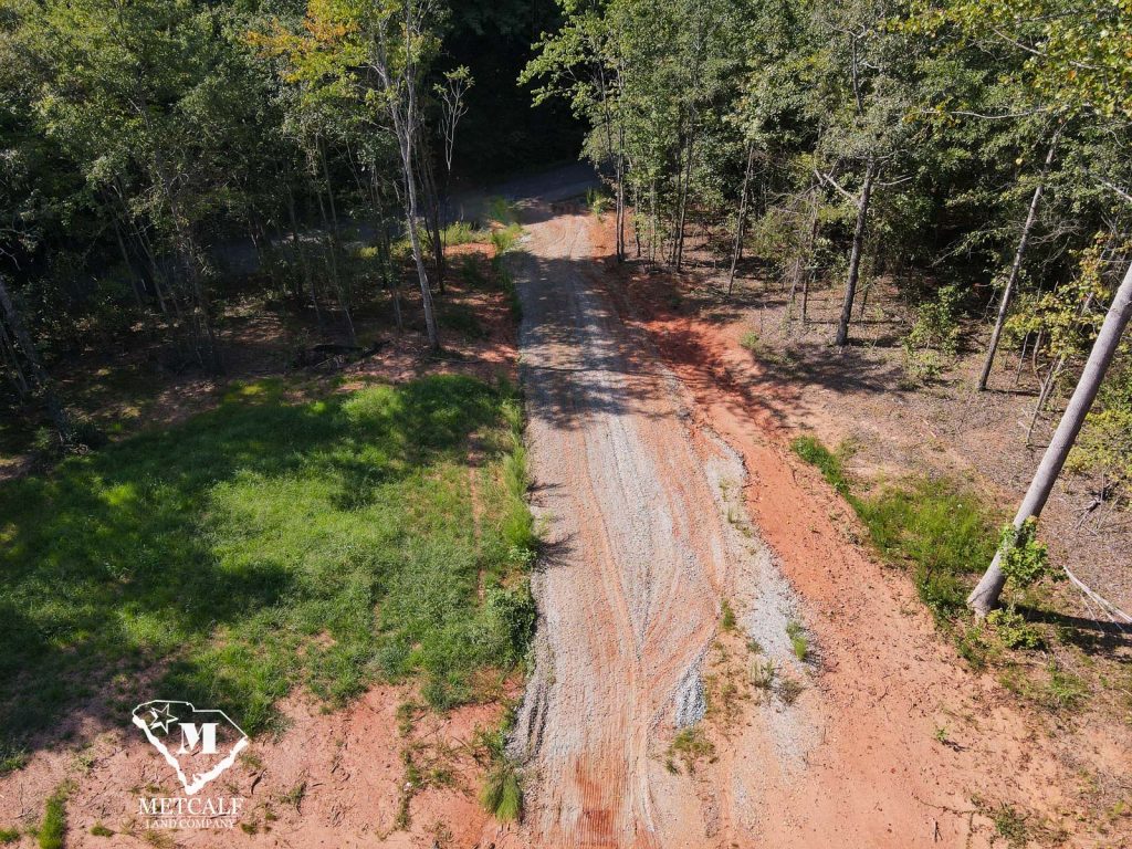 Cleared gravel path leading through a wooded area on a 2.5-acre homesite in Campobello.
