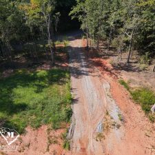 Cleared gravel path leading through a wooded area on a 2.5-acre homesite in Campobello.