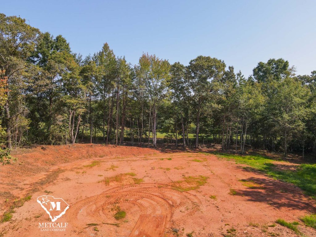 Cleared 2.5-acre homesite in Campobello, surrounded by trees and open land, ideal for building a private residence.