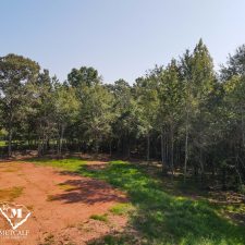 Cleared 2.5-acre homesite in Campobello, surrounded by trees and open space, ideal for building a private residence.