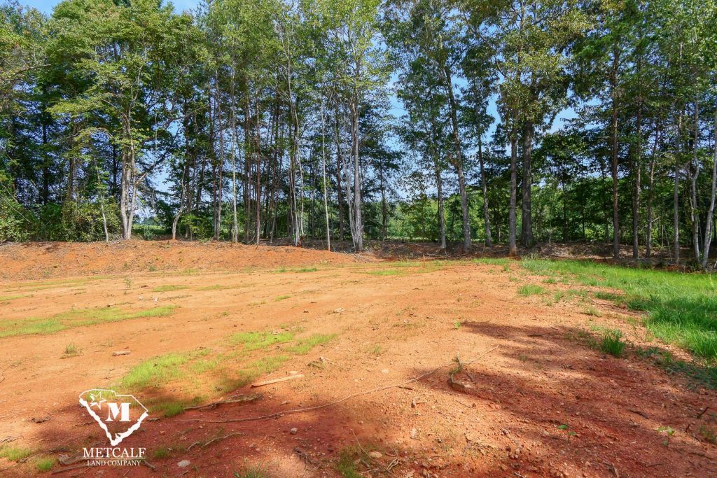 Cleared 2.5-acre homesite in Campobello, surrounded by trees and open land, ideal for building a private residence.
