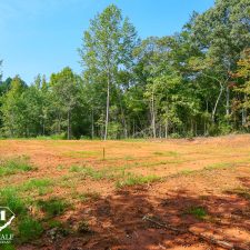 Cleared 2.5-acre homesite in Campobello surrounded by trees and greenery, ideal for building a private residence.